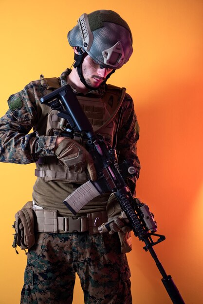 Modern soldier against yellow background