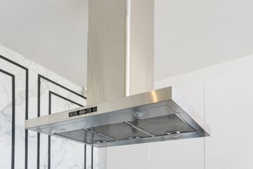 Premium Photo | Modern stainless steel and range hood in the kitchen ...