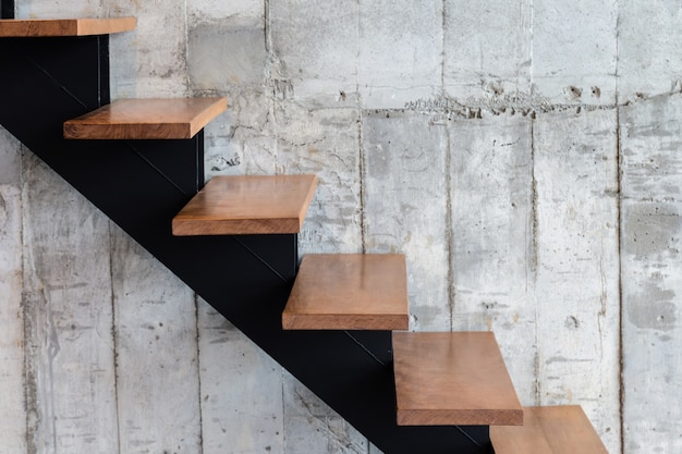 Modern structure stair with wooden step and concrete texture background 