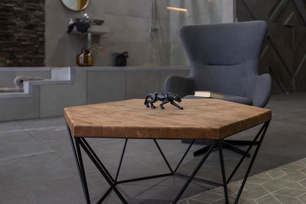 Modern studio interior with decorative stone walls in grey stone wood tiles and led lighting in the design of the room