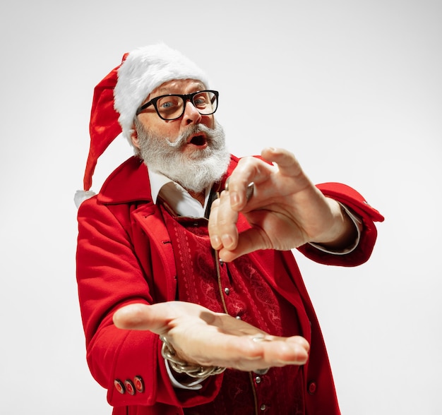 Modern stylish Santa Claus isolated on white, copyspace