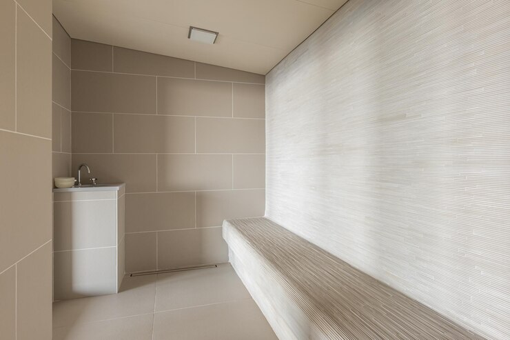 Modern and stylish sauna or hammam in resort. Calm tiled interior of contemporary wellness system.