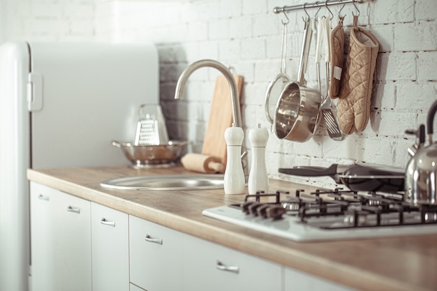 Modern stylish Scandinavian kitchen interior with kitchen accessories.