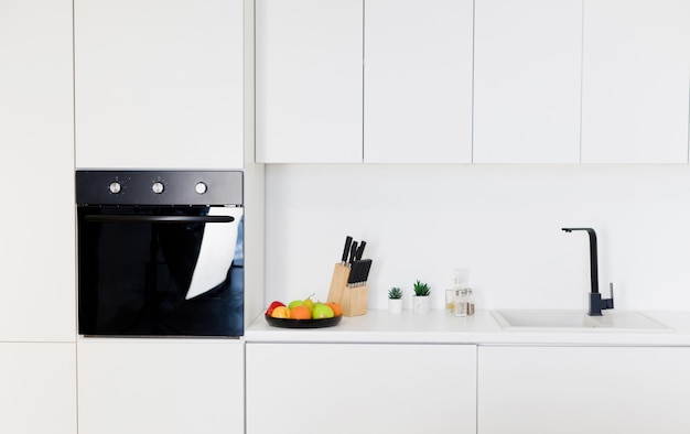 Modern stylish white kitchen with oven