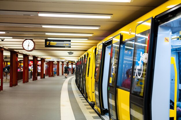 Modern subway. Yellow train at the station