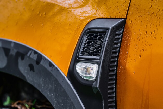 Modern SUV turn signal. Car turn signal close up. Close up of the left turn signal.