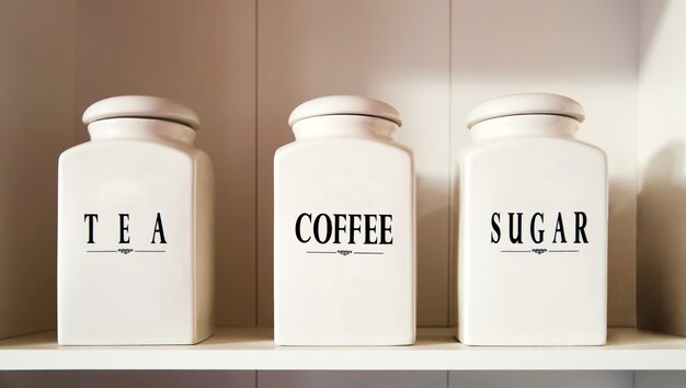 Photo modern tea coffee and sugar bowl in pantry shelf