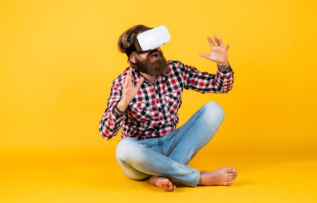 Modern technologies man with glasses of virtual reality future\
technology concept visual reality concept guy getting experience\
using vrheadset glasses bearded hipster use modern technology