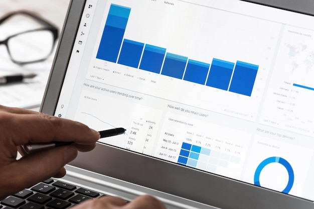 Modern technology concept web traffic analytics in the office on the touch screen of the notebook