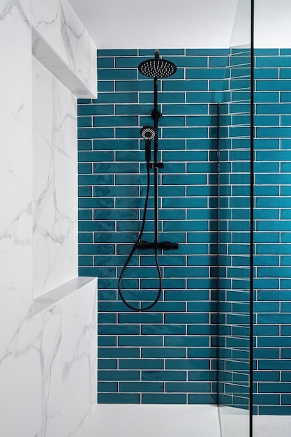 Modern tiled shower with rain head and handheld shower