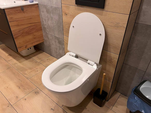 Modern toilet in the bathroom The bathroom overlooks the closed toilet New ceramic white toilet bowl in a modern bathroom Comfy and stylish lavatory in the apartment