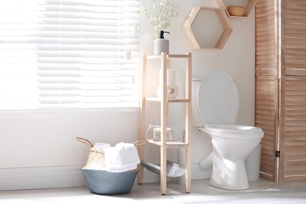 Modern toilet bowl in stylish bathroom interior