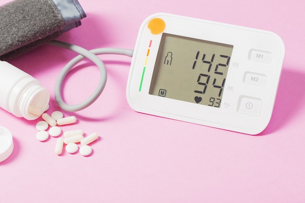 modern tonometer on pink background