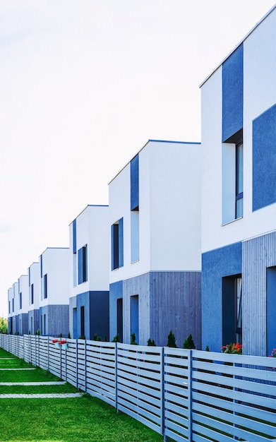 Modern townhouse residential apartment and flat building exterior. Detail of New luxury house and home cottage complex. Part of City Real estate property and condo architecture