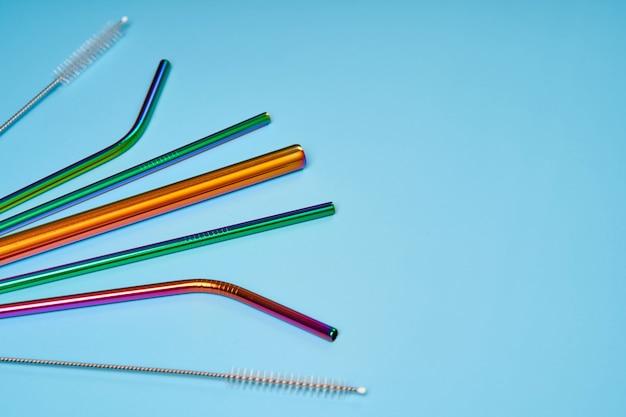 The modern trend in environmental care. Reusable metal straws for drinks. Replacement with common plastic beverage straws.