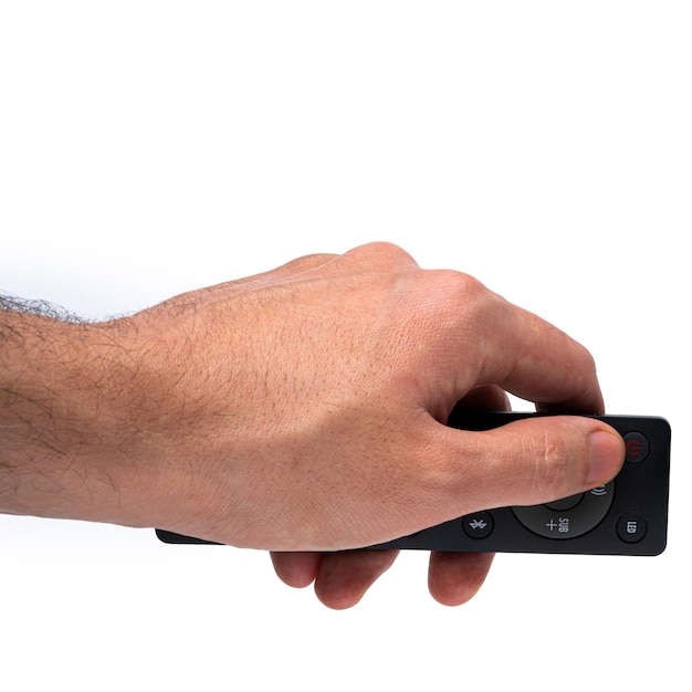 Современный пульт дистанционного управления телевизором в мужской руке на белом фоне