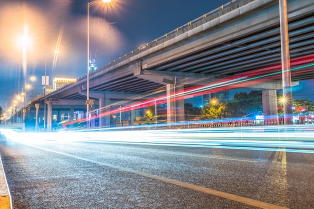 Modern urban construction and road vehicles, night view