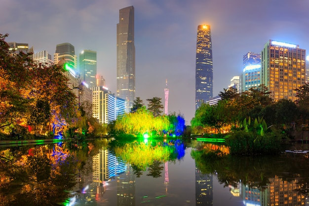 Modern urban night view and waterfront buildings in the park at guangzhou, China