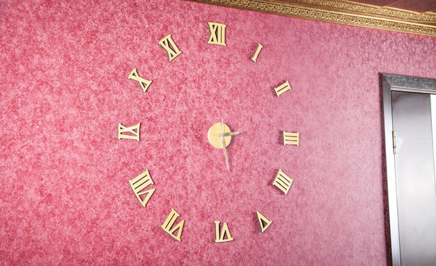 Modern wall clock in room.