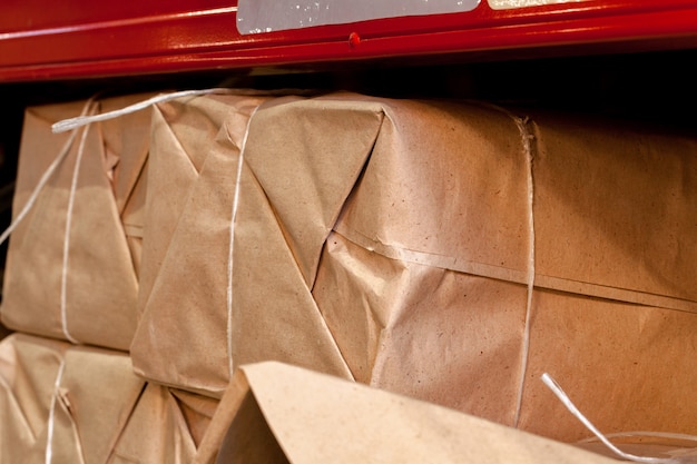 Modern warehouse shelves with pile of cardboard boxes