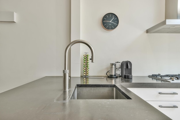 Modern washbasin under counter in kitchen