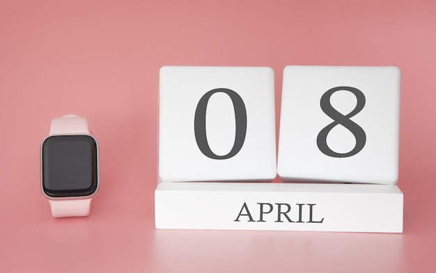 Modern Watch with cube calendar and date 08 april on pink background. Concept spring time vacation.