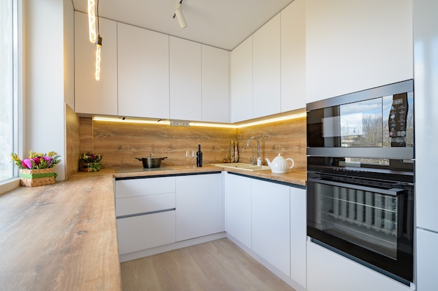 Modern white and beige wooden kitchen interior