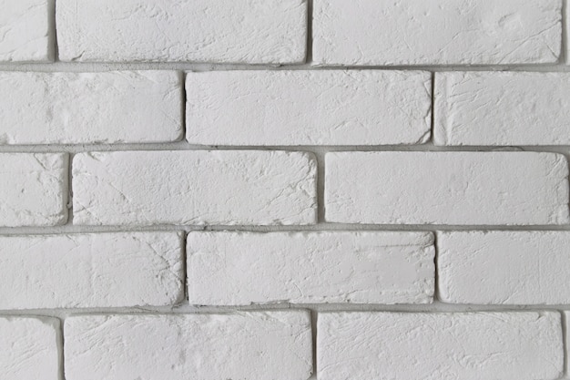 Foto struttura bianca moderna del muro di mattoni come fondo