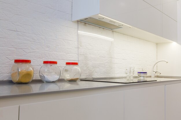 Modern white kitchen without handles