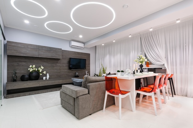 Modern white living room with dining table