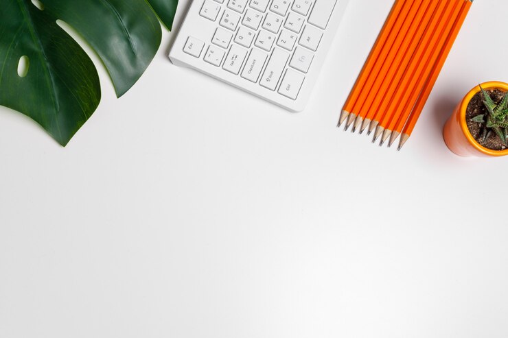 Photo modern white office desk table with computer keyboard and supplies. top view with copy space, flat lay.
