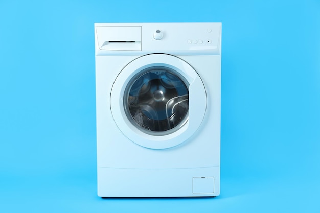 Modern white washing machine on blue background