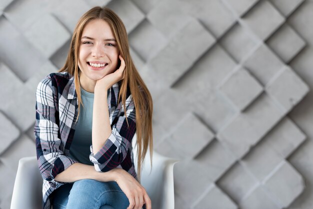 Modern woman looking at camera with copy space