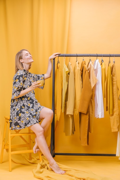 Modern woman next to wardrobe