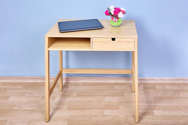 Modern wood console table with storage against blue wall