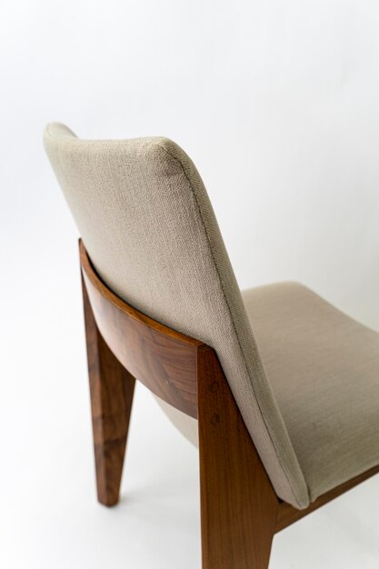 Modern wooden chair with fabric on white background mexico