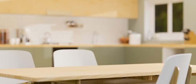 Modern wooden dining table with space on top over blurred stylish kitchen in background 3d render