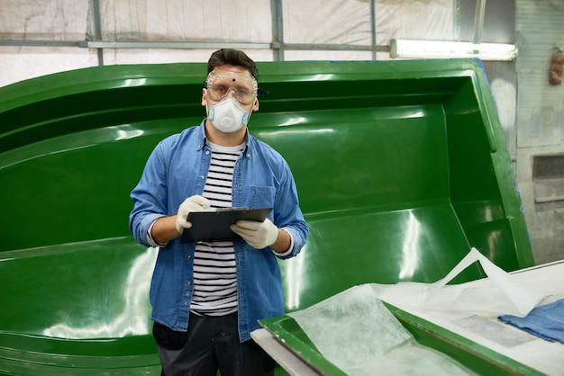 Modern Worker Posing in Boat Making  Workshop