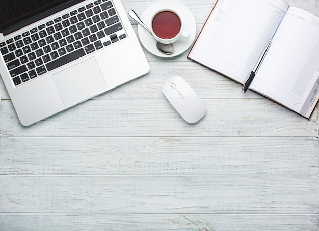 Modern workplace on desk table with a lot of things on it