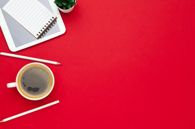 Modern workplace with cup of coffee, top view