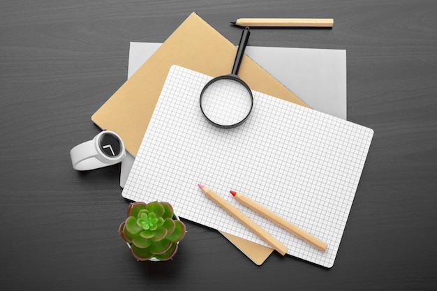 Modern workplace on wooden table with a lot of things on it. top view