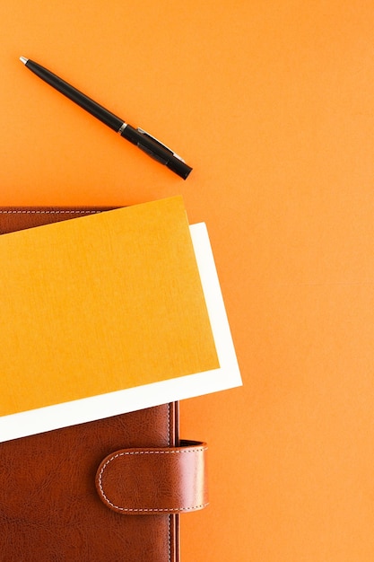 Modern workspace productivity and corporate lifestyle concept - luxury business brown brief-case on the office table desk flatlay