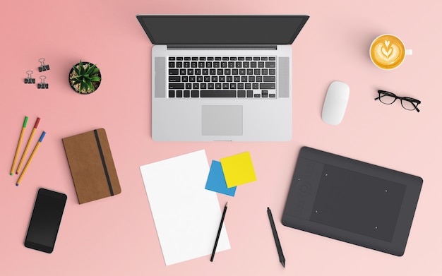 Area di lavoro moderna con tazza di caffè, notebook, smartphone e laptop su colore rosa