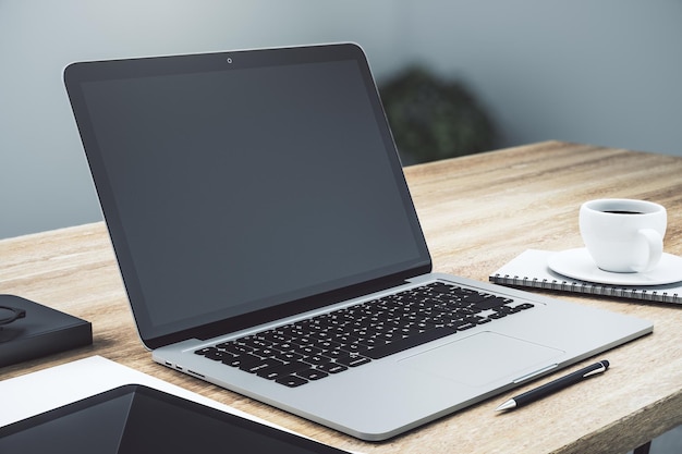 Modern workspace with empty laptop