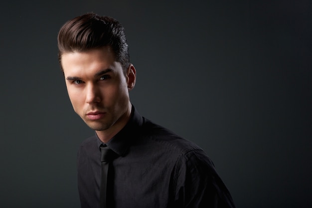 Modern young man with cool hairstyle