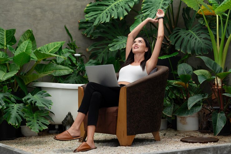 Photo modern young woman working remotely or relaxing in tropical garden blithe
