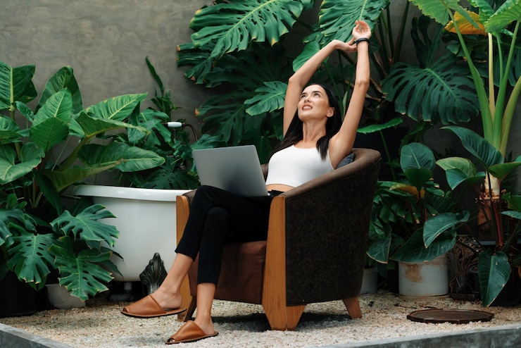 Photo modern young woman working remotely or relaxing in tropical garden blithe