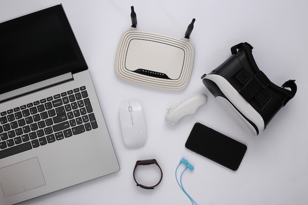 Modern youth gadgets on a white background. Top view. Flat lay