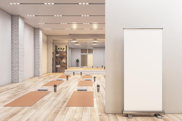 Moderne betonnen yoga gym interieur met apparatuur leeg frame op muur daglicht en houten vloeren Gezond levensstijl concept Mock up 3D Rendering