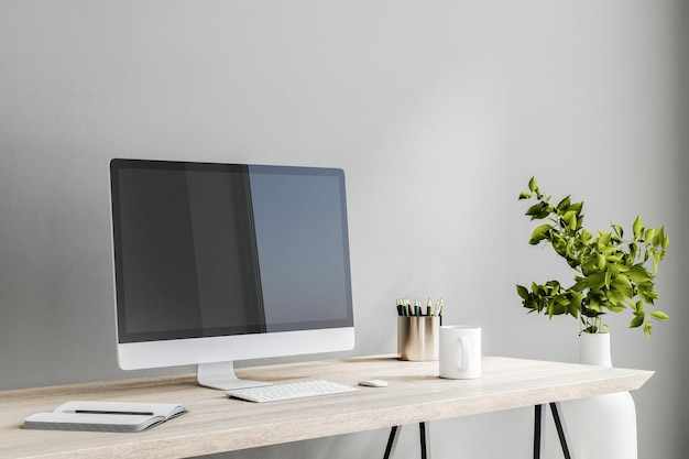 Moderne computermonitor op houten tafel met wit toetsenbord notebook en koffiemok op lichtgrijze muur achtergrond in stijlvolle kamer